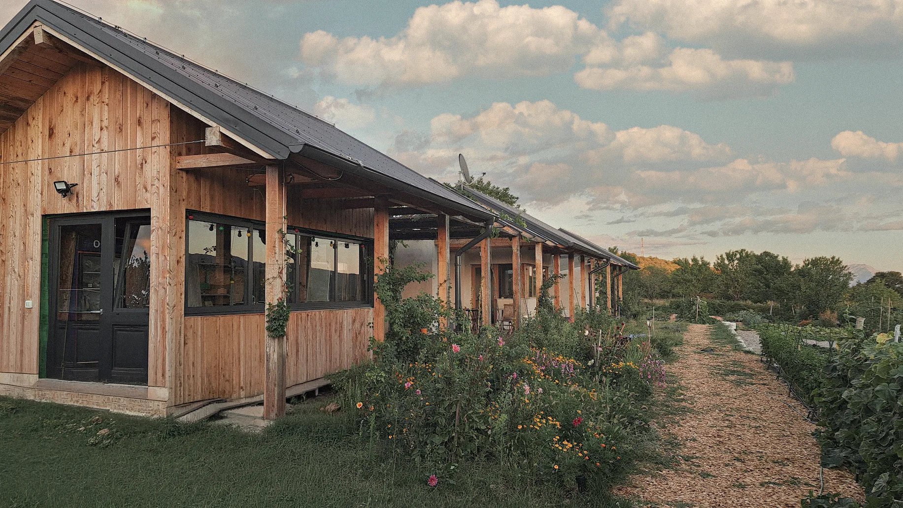 Hempcrete house at evening, garden in front